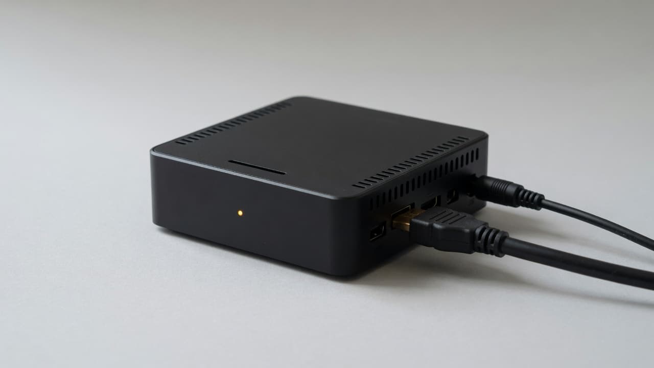 The DealerSign Signage Player, a compact black media player with HDMI